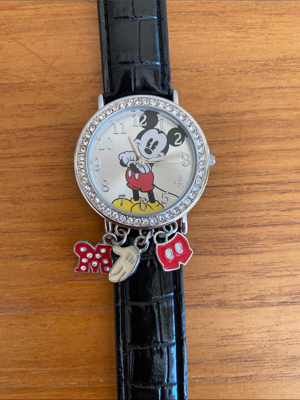 Mickey Mouse watch w crystal bezel and charms. Black faux alligator strap.
🖤❤️🤍